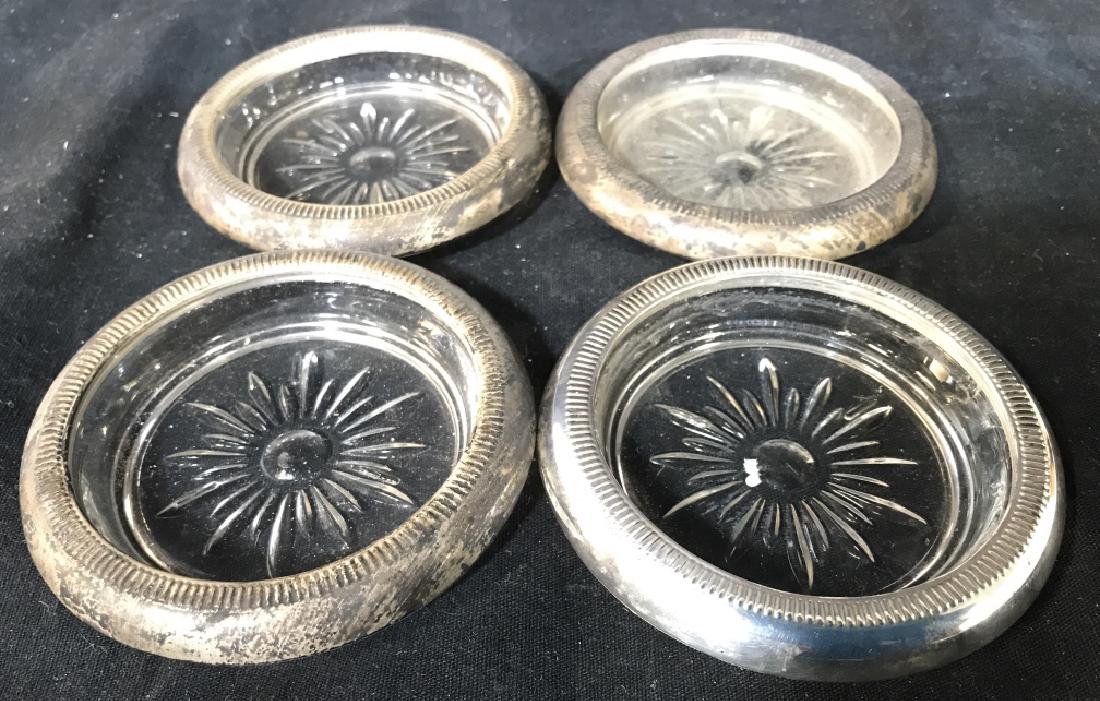 Set 4 Silver Toned & Glass Coasters: Lot includes 4 coaster. Each contains silver toned metal edges. Measures 3.75 inches wide. Each have some wear. trinket dishes, coasters, vanity accessory, tabletop accessory 6