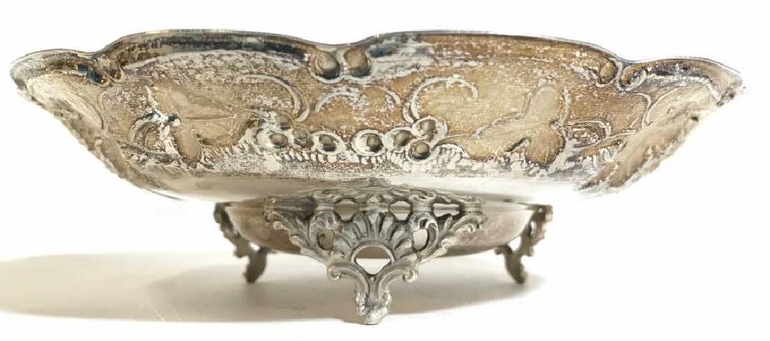 Sterling Silver Footed Bowl: Bowl contains grape, leaf, & vine detail. Center of bowl is marked 925. Contains 3 ornately Detailed Feet. Measures approximately 7 inches wide 2 inches tall. Footed dish, tableware, tabletop accessor