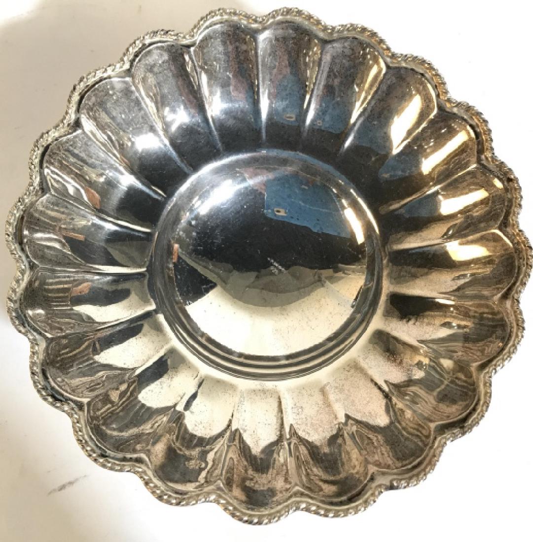 Sterling Silver Footed Bowl: Bowl contains 3 feet. Center of piece is marked 925. Measures approx 6 inches wide 2 inches tall. Trinket dish, candy dish, tabletop accessory, tableware 6.