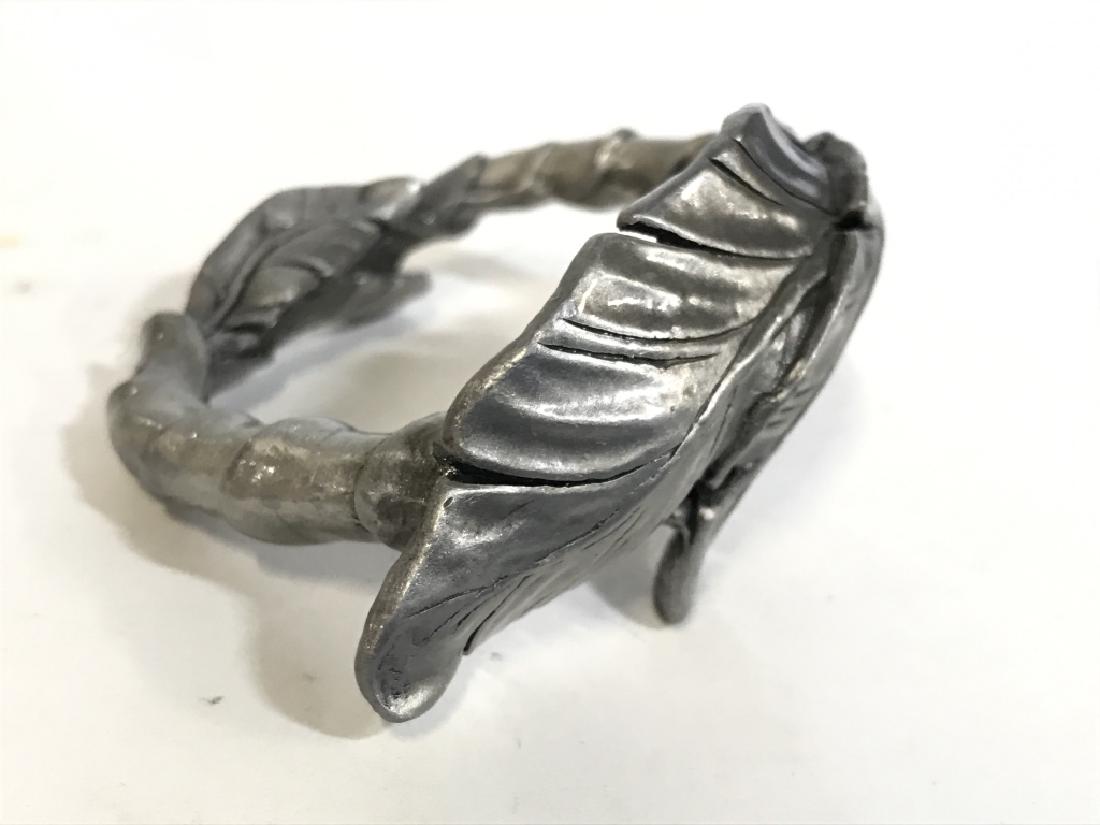 Lot 4 Leaf Detailed Metal Napkin Rings: Lot includes 4 metal Napkins rings. Each appear to be signature marking. Each measures 2.75 inches wide. tabletop accessory, tableware, napkin holders 6