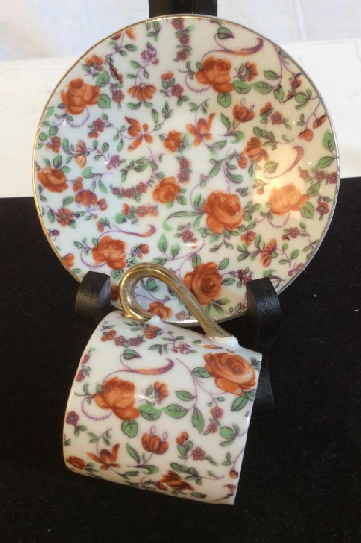 Vintage Inarco Demitasse Rose Tea Cup And Saucer: Chintz Porcelain From Japan. Orange Roses. Stamped underside E- 728. Has gold rim fading but chintz is vibrant. Saucer 4 1/4 in. Cup 2 x 2. Vintage Porcelain Espresso, Vintage Chintz Demitasse China,