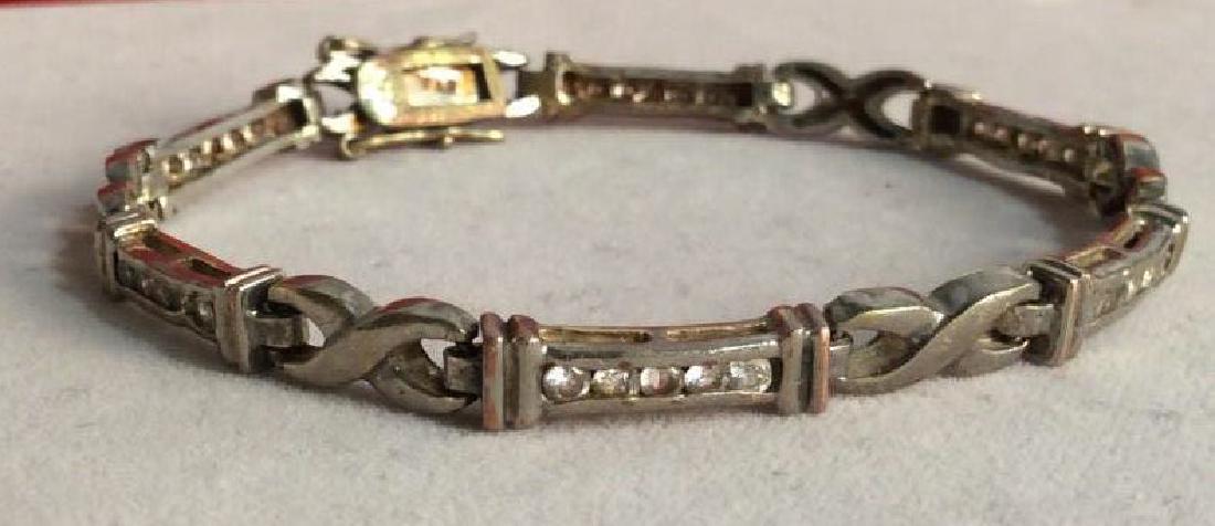 Vintage FAS Rhinestone Tennis Bracelet: Bracelet appears to be marked FAS on one end, on other end three digit stamp appears to read 925, indicating sterling silver, possibly reads 825, indicating lower purity silver. Rhinestone tennis brac