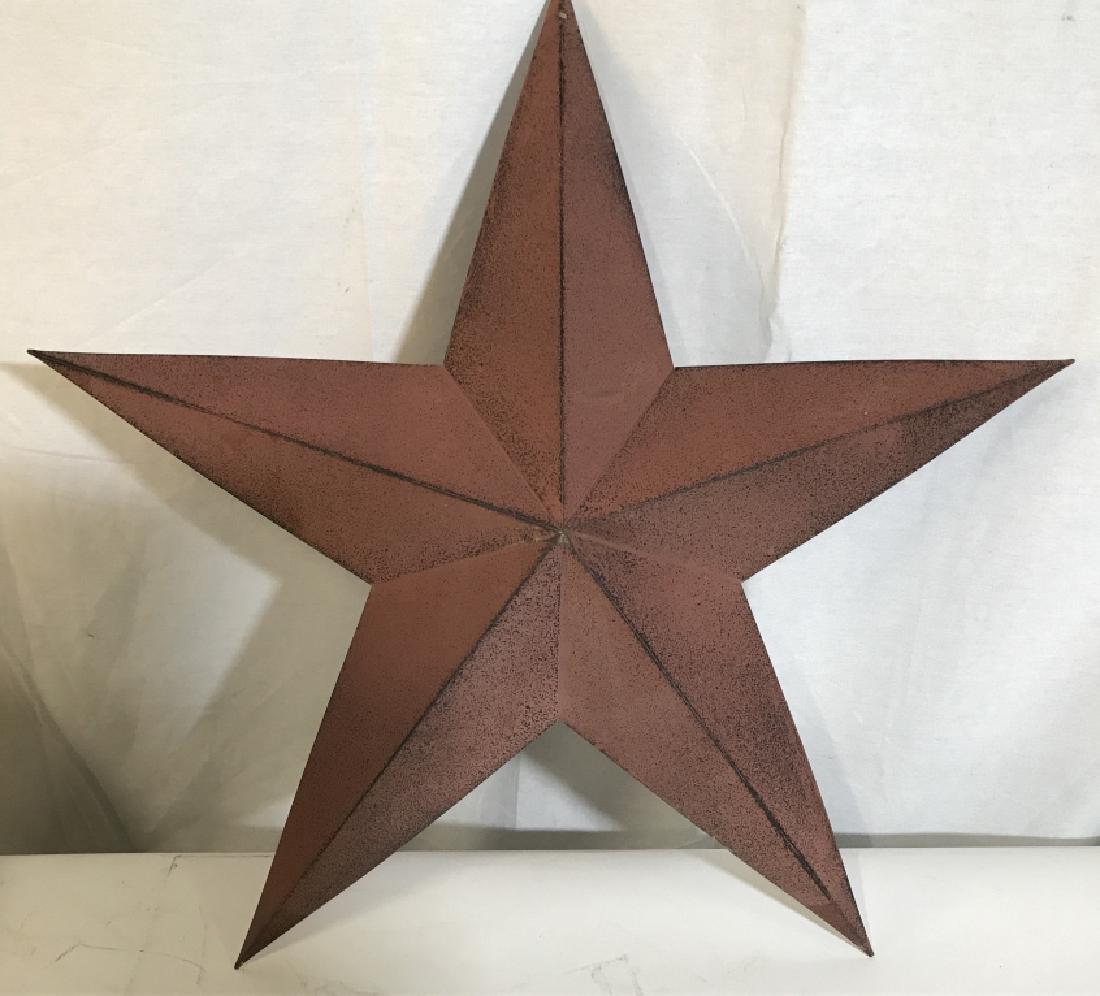 Vintage Metal Decor Star: Light Brick Red toned with Splashes of Black. Hole on top for a nail for hanging. Decor Piece. needs cleaning . From longest Tips, 2 1/5 Ft. Wide. From Top to Bottom Tip, 2 Ft. Long. Beach Wall Decor,