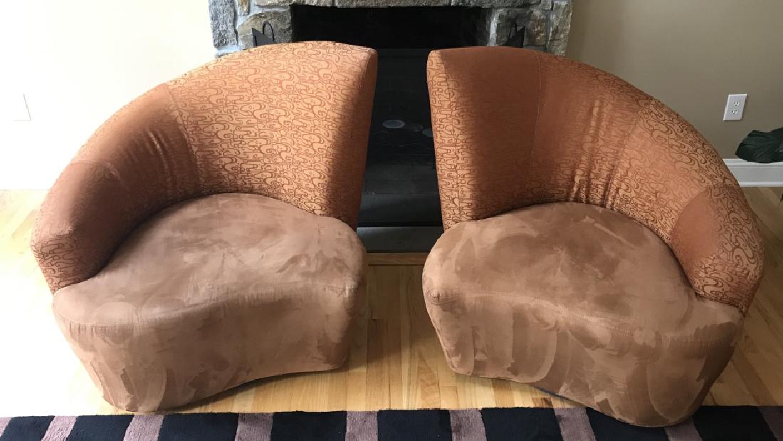 Pair MCM Asymmetrical Fan Back Swivel Club Chairs: In the style of Vladimir Kagan. Abstract geometric patterned back fabric upholstery with brown suede style fabric for seats. Each Measures approx 37 inches in height by 38 inches in width by 36 inches