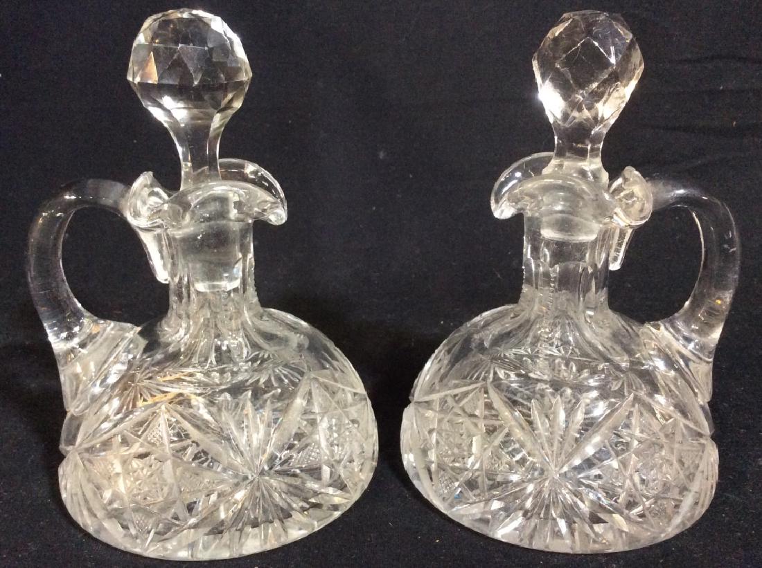 Pair Cut Crystal Creamers W Stoppers: Lot includes 2 creamers. Each piece includes stopper. Each piece is Cut Crystal. Each piece measures approx 6 inches tall 4 inches wide. tableware, tabletop accessory 6