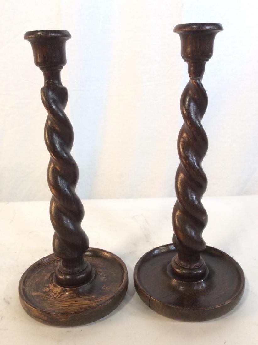 Brown Toned Carved Wooden Candlesticks: Candlesticks are Wooden. Possibly hand carved. Each measures approx 12 inches tall 5 inches wide. Candlesticks, Wooden candlesticks, Carved Wooden Candlesticks. tableware, tbaletop decor Each piece ha
