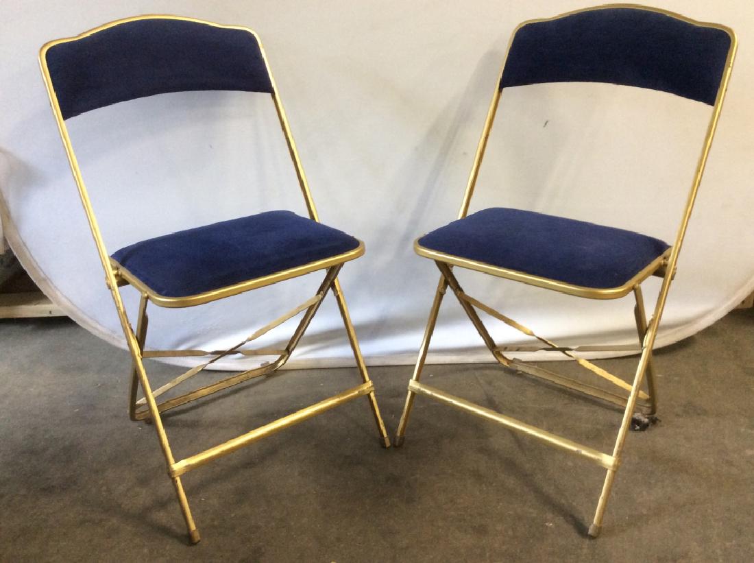 Pair Vintage Metal Folding Chairs: Chairs are metal with blue Toned cushions. Each measures approx 32 inches tall 17 inches wide 18 inches deep. folding chairs, home accessories, extra seating 6.