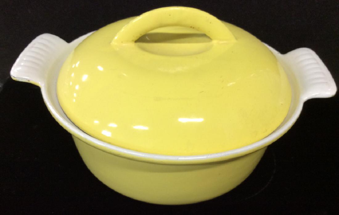 DESCOWARE Enamel on Metal Cookware: Lidded Vessel, bright yellow finish, possibly enamel finish, some minor surface wear. Measures 5 in by 9 in by 8 in, cookware, tableware, tabletop accessory, kitchen accessory. 4