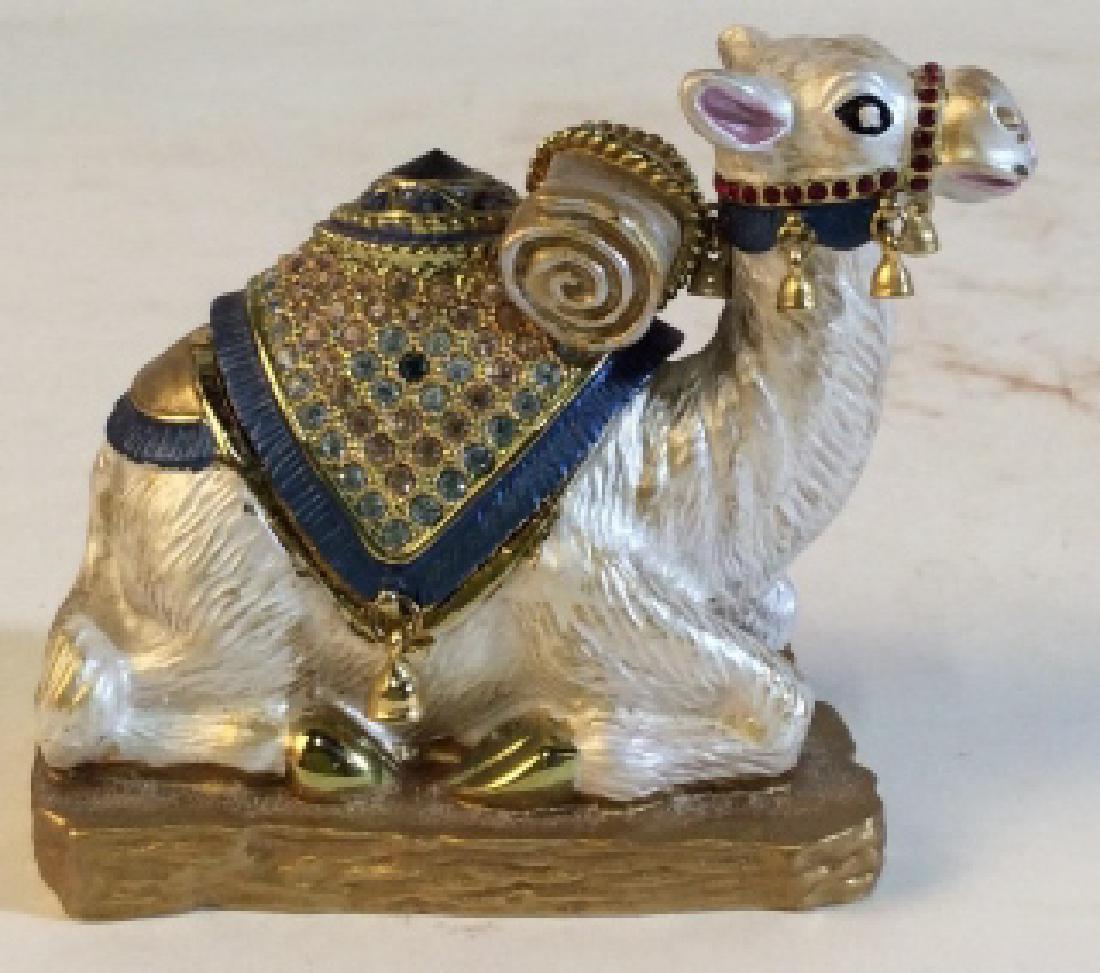 Rhinestone Magnetic Camel Box: Painted metal Camel Figure with magnetic removable rhinestone encrusted hump, revealing a small compartment for pills, coins, trinkets, etc. Measures at 2.5 in tall, and 2.6 in wide. Trinket Box, Pill