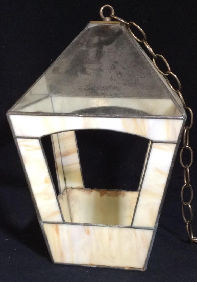Hanging Lantern with Chain: Made of a plastic like material, 4 sides. Has bottom, some amounts surface scuff. Approx 15 in H, approx 36.5 in widest circumference. Chain, 36 in. Lighting, Indoor/Outdoor Light, Garden, Home Decor,