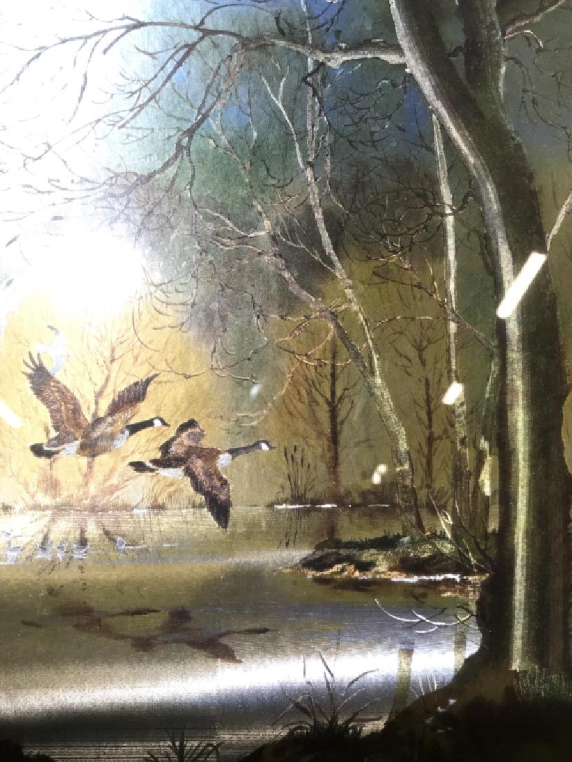 Lot 2 Framed Multimedia Duck Artwork: Pieces depict ducks and geese flying and swimming in a pond. Pieces are professionally framed with wooden frames. Each measures approx 19 inches tall 16 inches wide. wall art, home decor, scenic artwo