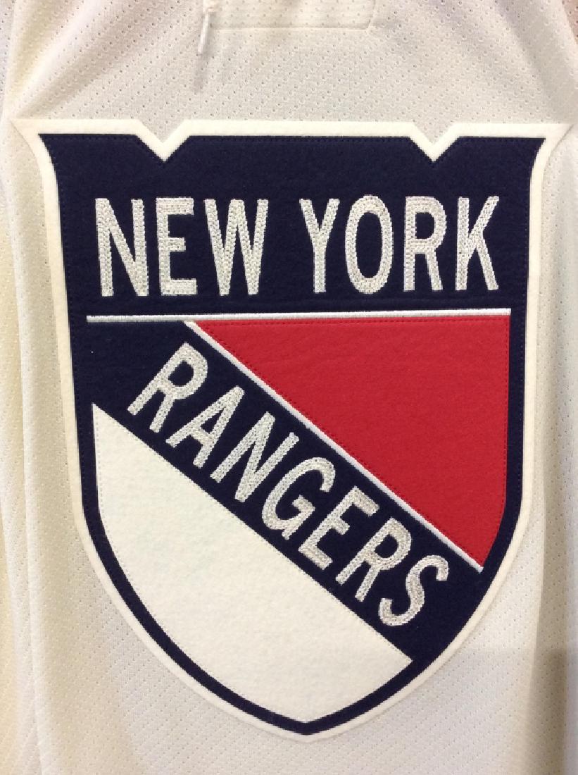 Reebok New York Rangers Hockey Jersey: Jersey is size XL. Contains tones of red white & blue. Backside reads HESS 12. Appears to have never been worn. Jersey, sports collectible, hockey jersey memorabilia 6.
