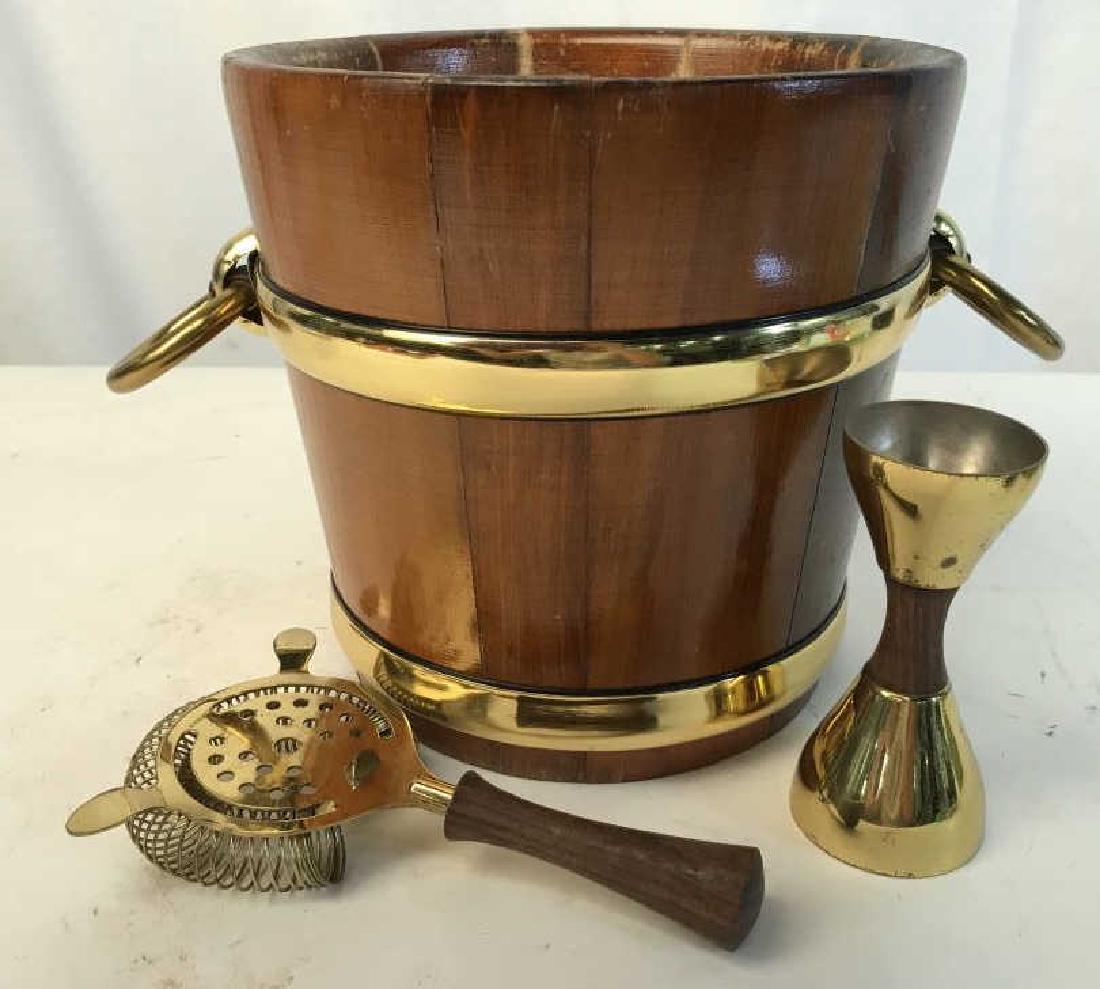 Wood Brass Ice Bucket w Tools: Vintage bar set, brass banded wood ice bucket, has wear, with bar tool accessories, bucket measures ht app 8 inches, diameter app 8 inches without rings,