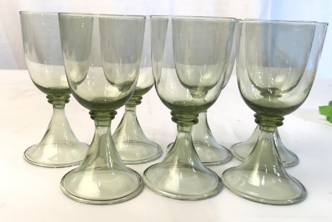 Set 7 Green Crystal Stemware: Wine glasses, water glasses, bar ware, tableware, Crystal goblets in green tinted glass, each hand formed, crystal table ware each measures ht app 6 inches base diameter app 3 inches