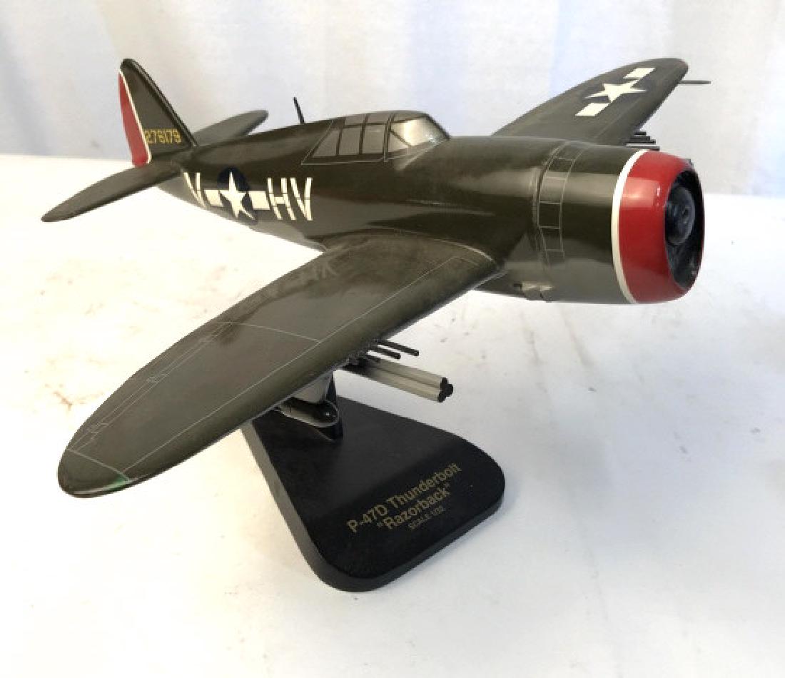 Wood model Fighter Plane Model on Stand: Painted model plane reads tail number 276179, V-*HV, , base reads P-47D Thunderbolt Razorback, scale 1/32, model plane, measures ht app 9 inches wing span 16 inches depth app 14 inches, fighter plane 