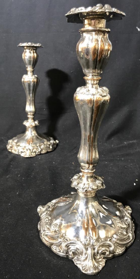 Pair Silver Toned Metal Candlesticks: Piece are possibly pewter. Piece contain ornate detail around base. Measures approx 11.5 inches tall 6 inches wide. candlesticks, tableware, tabletop accessories, mantel piece decor 6