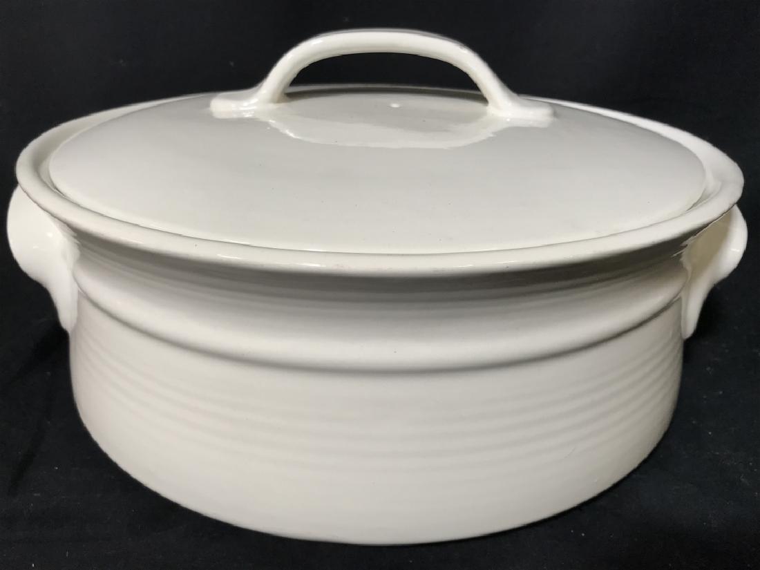 White Toned Lidded Porcelain Serving Pot: Piece is white toned & Porcelain. Piece includes lid. Contains handle on each side. Measures approx 13.5 inches wide, 6.5 inches tall. serving vessel, kitchenware, decorative arts and decor 6.