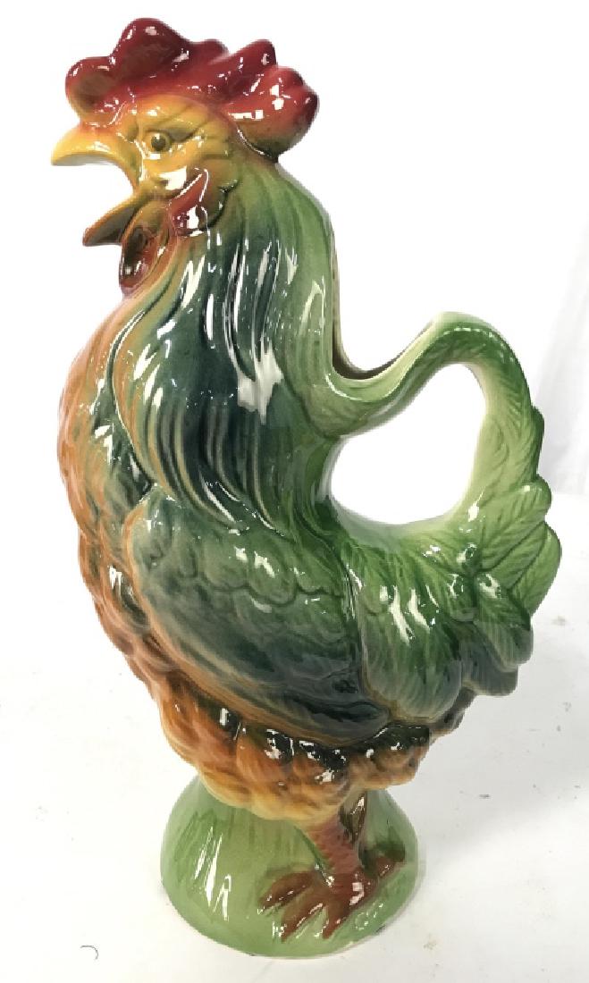 S CLEMENT FRANCE Ceramic Rooster Pitcher: Underside of piece is marked S CLEMENT FRANCE. Pitcher has rooster Figural shape. Beak area is spout. Measures approx 11 inches tall 6.5 inches wide. Home accent, home decoration, tableware, centerpie