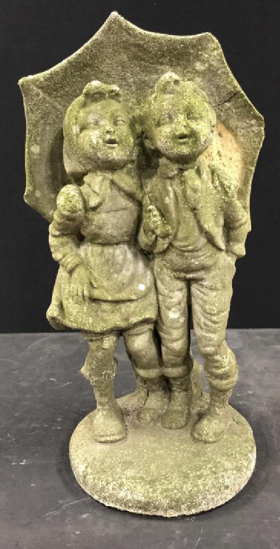 Vintage Stone Cement Garden Ornament: Vintage Stone Cement Garden Ornament Depicting Two children walking under an umbrella, Moss patina to exterior, crack to side of umbrella, needs cleaning, measures approx 14 inches tall x 7 inches wid