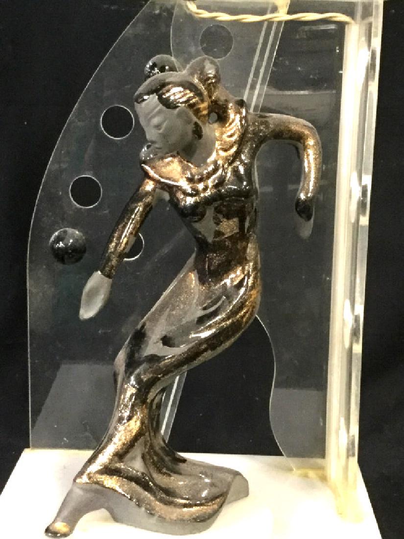 Mid Century Modern w/ Art Deco Figurine Lamp: Mixed Media Table Lamp- Clear & White Lucite, Black Clay, Glitter Glaze. Dancing woman Figurine on Turntable, some wobble. Lighting above and below. Loose Lightbult socket. Possibly needs Wiring Fixed