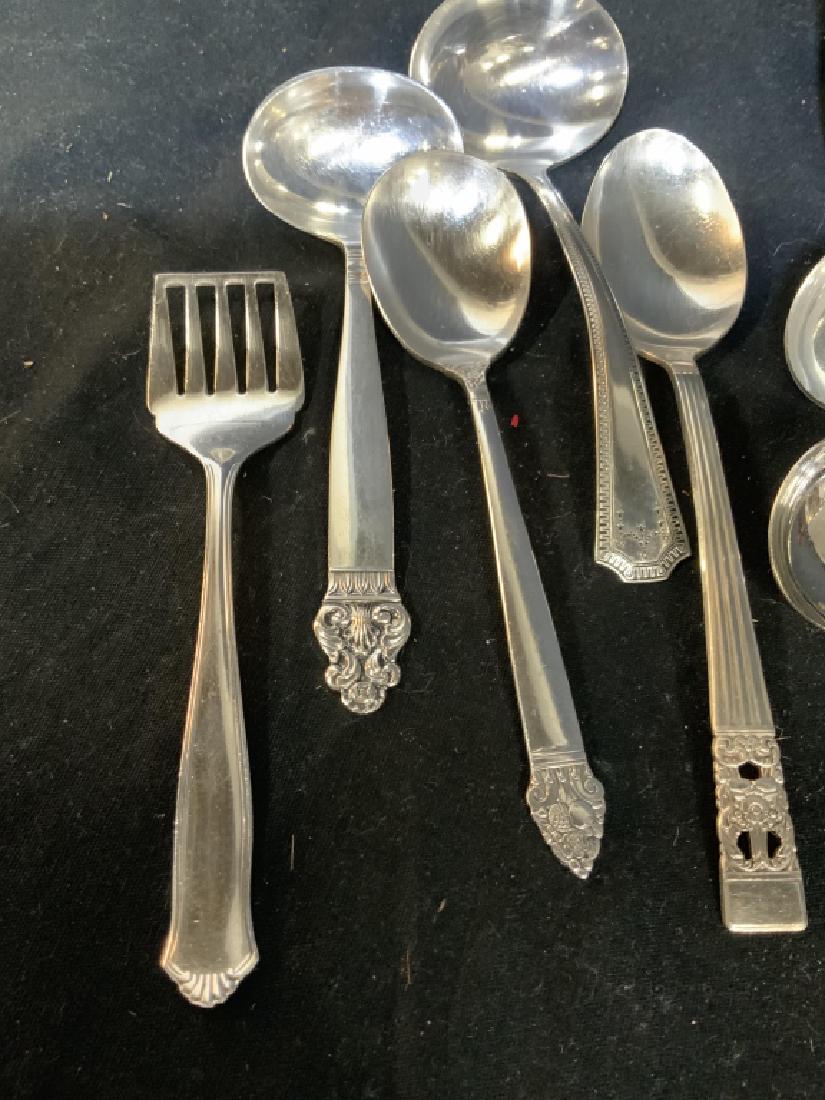 Assorted Silver Plate Serving Utensils: Some marked for England, for Sweden, for Norway, longest measures 10 inches, serving spoons. Pair servers, ladles , serving spoons, and more, property of Greenwich Estate