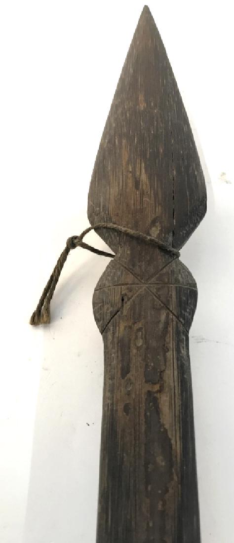 Vintage Carved Wooden Tribal Style Weapon: Piece is carved wood. Contains multi toned string detail around center of piece. Measures approx 35 inches long. Piece is vintage. Weapon, collectible, decorative accessory 6