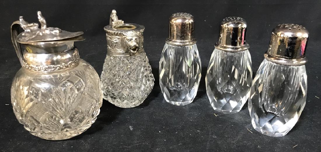 Lot 5- Vintage Cut Glass Tableware: Servers & salt and pepper shakers. One server missing flip top. Round server measures 4 3/4 W x 5.5 in H. Art Nouveau Metal Decor. One salt/ Pepper vessel has US patent no 3136491, top doesn’t seem 