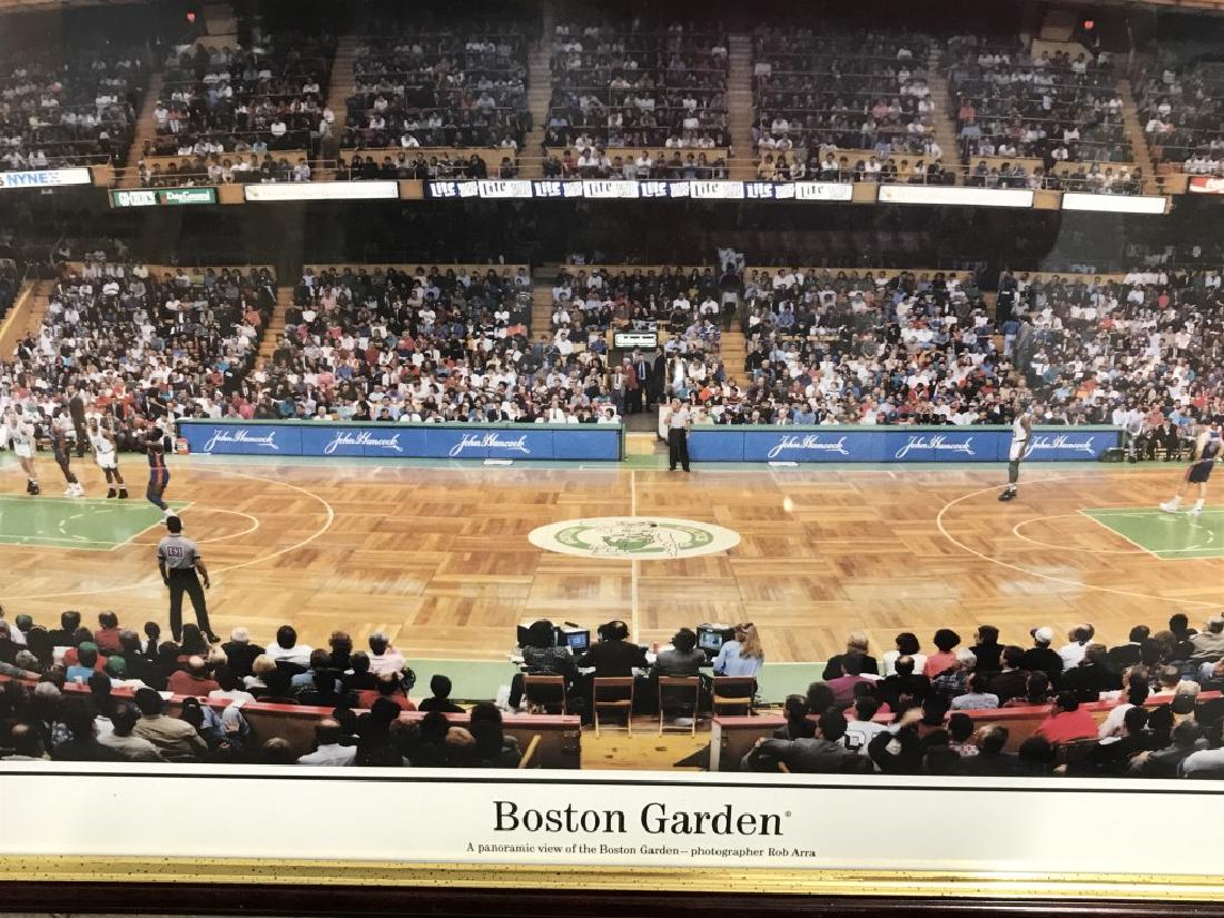 Framed Rob Arra Poster Print, the Boston Garden: Poster depicts Rob Arra’s panoramic view of the Boston Garden during a basketball match. Poster is set behind glass In wood frame. Measures approx 15.5 inches in height by 40.8 inches in width with 