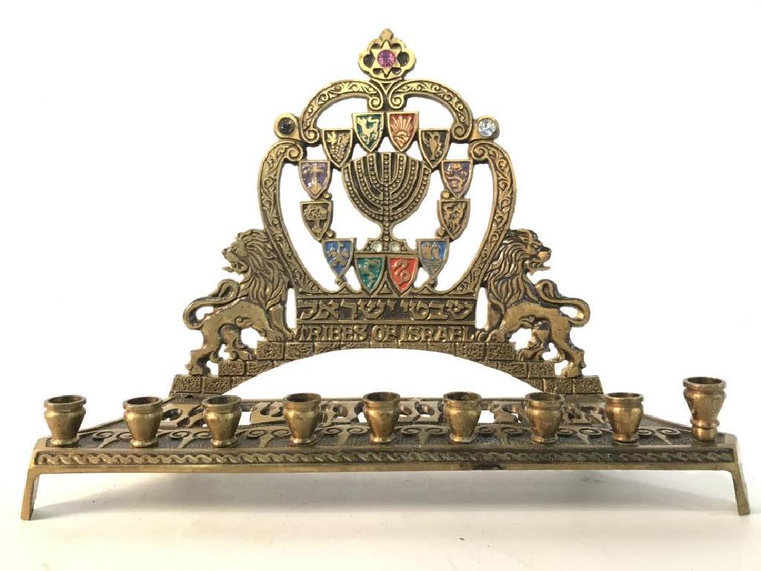 TAMAR EXPORT QUALITY Judaica Menorah: Backside is marked TAMAR EXPORT QUALITY MADE IN ISRAEL. Piece has Lion and Star of David Detail. Contains Hebrew characters. Measures approx 9.5 inches long 7 inches tall 3.5 inches deep. Needs to be 