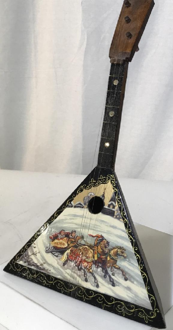 Vintage Handcrafted Balalaika Instrument: Possible Russian or Ukrainian. Stands up on its own by construction of angles . Made of wood. High Gloss Paint. Handpainted. Scene of Sleigh Horses in snow. Many of these hand painted Vintage Russian 
