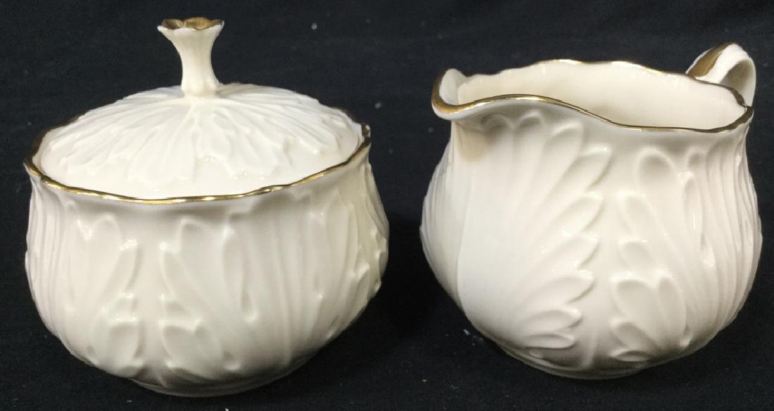 Lot 2 LENOX Porcelain Creamer & Lidded Sugar: Lot includes 1 Creamer & 1 sugar with lid. Each piece is marked LENOX on underside. Each measures approx 5 inches wide 3.5 inches tall. tableware, decorative accessories, tea service accessories, tabl