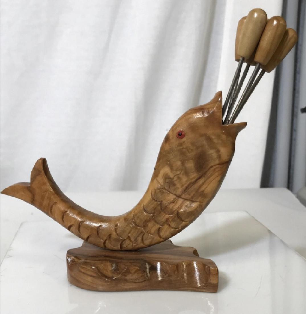 Set7 Carved Fish hors d'oeuvres forks Holder: Fish Design Wood Carved Holder With 6 Forks. Sticker on underside. Made in Spain. 7 in. Wide from fish tail to sticks, 6 in. from bottom to sticks. Crab Forks, Seafood Utensils, Hand Carved Wood Art,