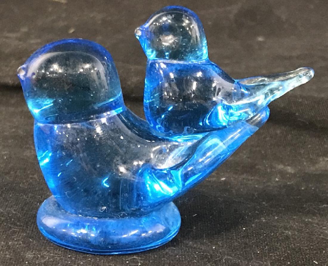 SIGNED Blue Art Glass Birdie Figurines: underside smaller birth, Signed ‘ 1998, Léon and’. Then underneath larger bird continues signature, ‘ Ron Ray’. Large Bird, 2.5 x 2 in.. Mostly surface scratches on bottom. Art glass. Bird Co