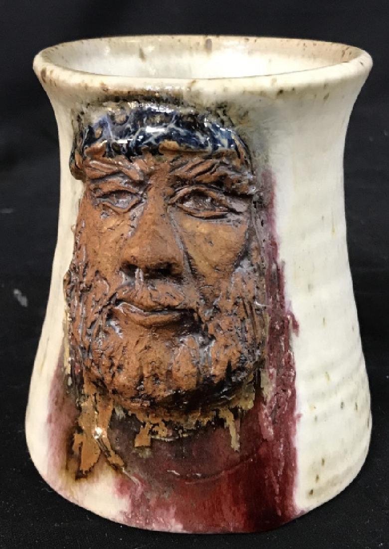 SIGNED HANDMADE Ceramic Mug: Face of man on Mug. Large handle. Tall mug. Approx 4 3/4 x 7 in. 3.5 in diameter. Bottom not glazed. Artist’s name partially illegible. First name Léon. No cracks. Handmade pottery, Artisanal Ceram