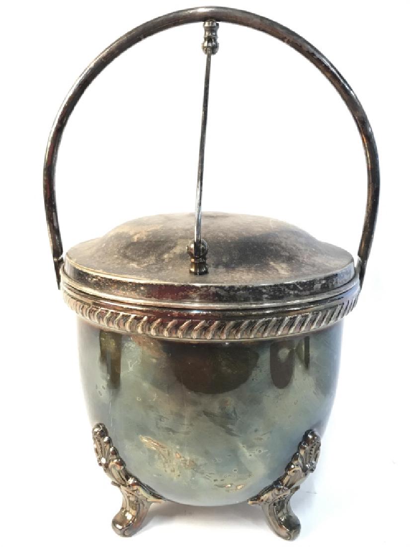 BRISTOL Silver Plated Lidded Footed Ice Bucket: Underside of piece reads BRISTOL SILVER PLATED. Piece has 4 feet. Piece measures approx 12 inches tall 8.5 inches wide. Silver plated bucket, ice bucket, bucket with handle. bar ware, tableware, 6