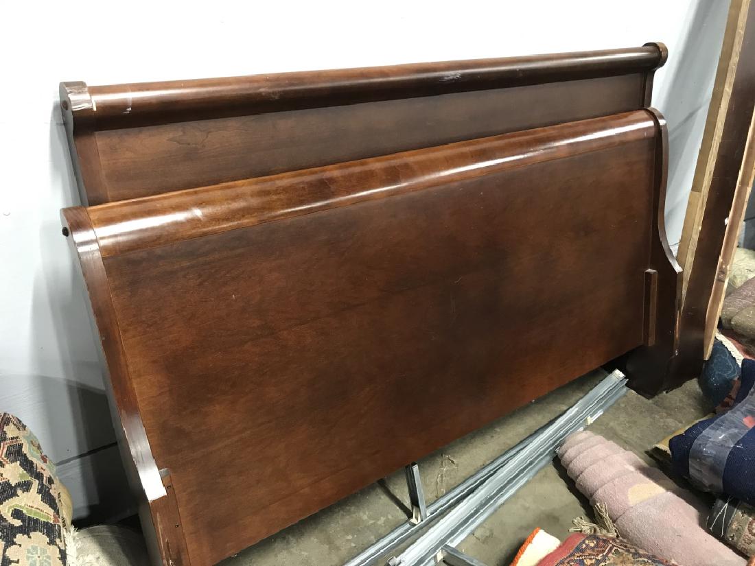 Vintage Wooden Sleigh Bed: Dark tone wood sleigh bed frame with headboard, footboard, and sideboards. Headboard measures approx 62.8 inches in width by 43 inches in height. Side boards measure approx 74 inches in length. Bed ha