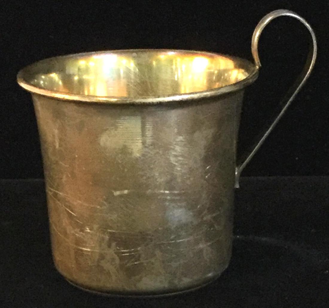 Sterling Silver Baby’s Keepsake Cup: Stamp Marked Sterling underneath. Cup 2 1/4 in H . 2 1/4 in. diameter. High Handle. Not Monogrammed. Surface Marks from age. Keepsake Cup, Sterling Silver Cup, Baby’s First Cup, Vintage Sterling Sil