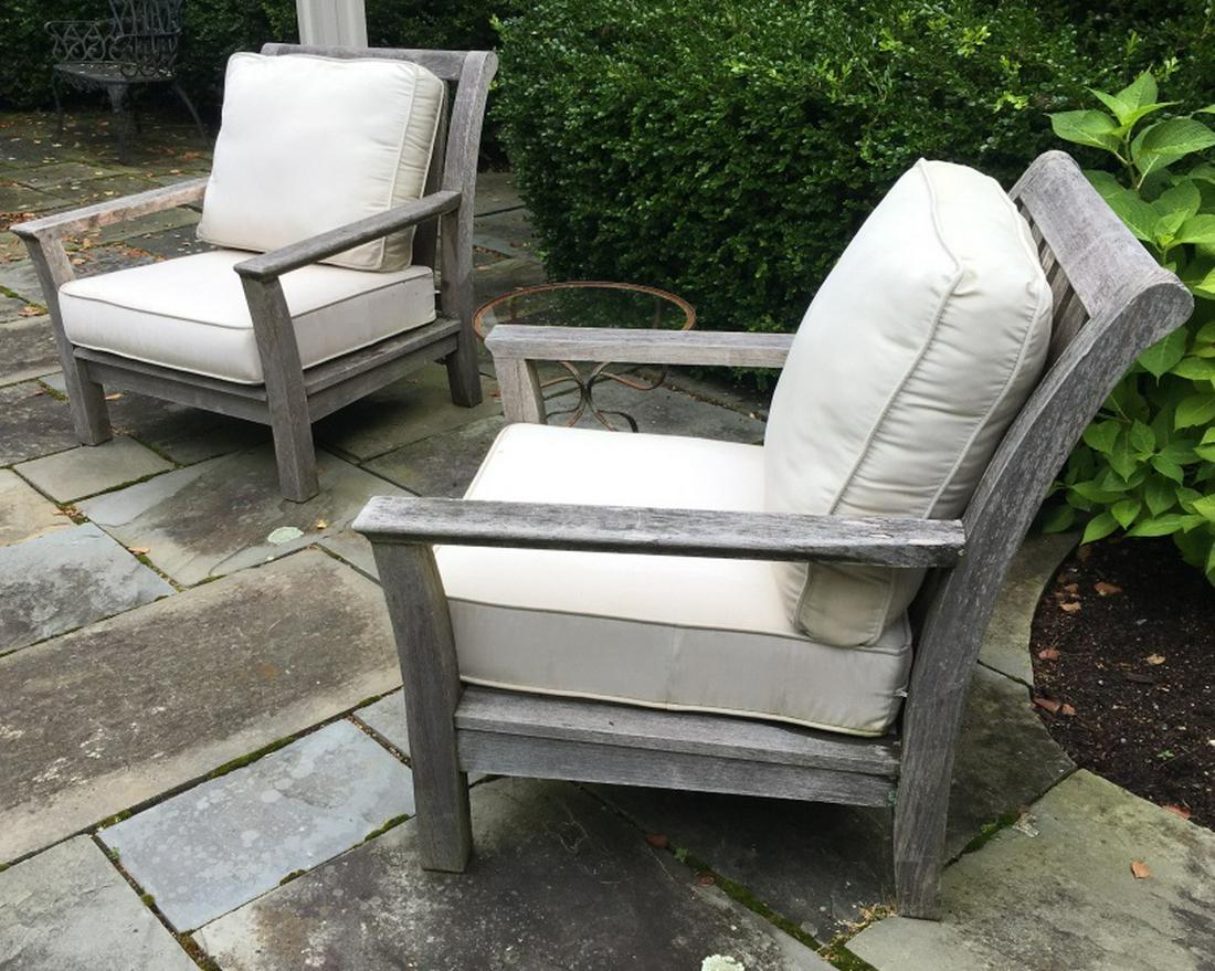 Pair KINGSLEY BATE Teak Club Chairs W Cushions: Pair KINGSLEY BATE Teak Outdoor Club Chairs W Cream Colored Cushions, measures approx 36 inches tall at back x 38 inches deep x 30 inches wide, needs light sanding and cushions need cleaning, marked o