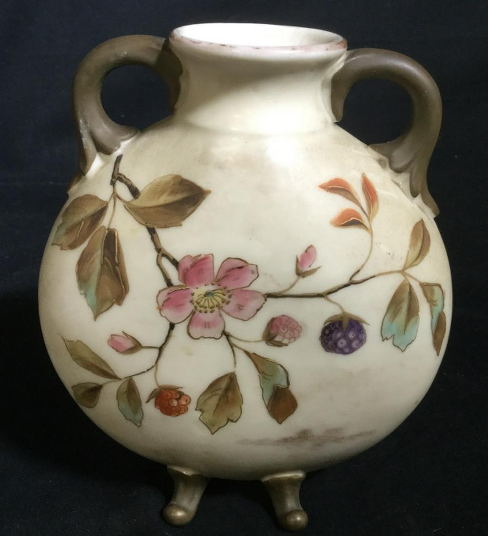 Royal Worcester Porcelain Vase: Hallmarked, Crown stamp recognizable, appears to read Carlsbad in the purple circle underneath crown. Footed Floral Cream Vase with Handles. Measures 5 3/4 in. H, 5 1/4 in. W. Opening, 1.5 in. diamete