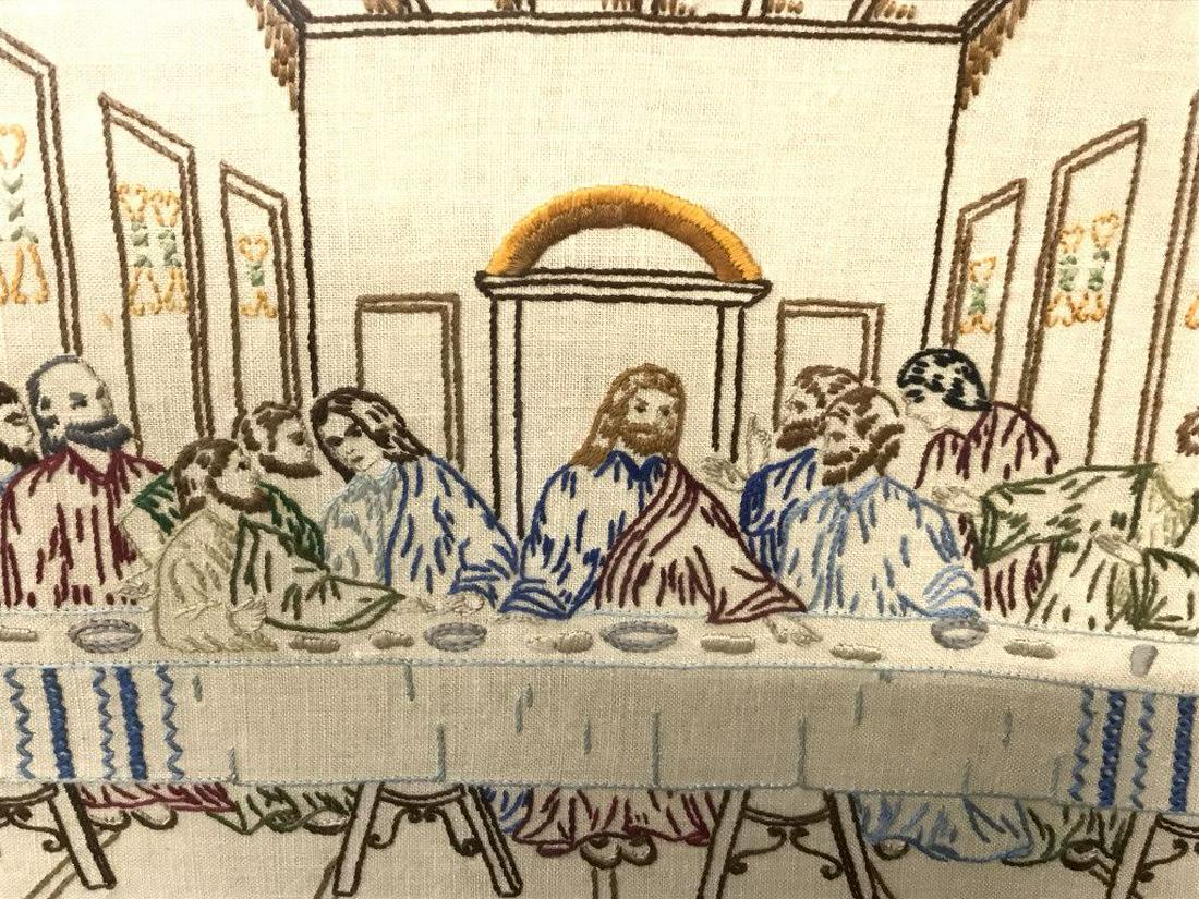 Framed Vintage Sampler Depicting the Last Supper: Sampler depicts the Last Summer, with Jesus and the Apostles embroidered in multicolored tones. Sampler is matted and set behind glass in wood frame. Measures approx 18.2 inches in height by 22.25 inc