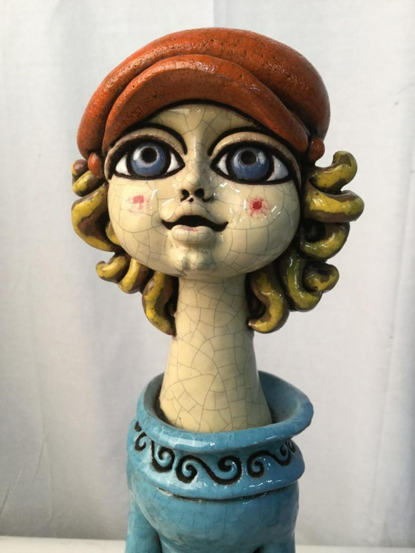 PInho Dinis Ceramic Sculpture of Boy Fishing: ARTIST SIGNED on undersigned. Vintage piece by renowned Brazilian Sculptor and Cubist Artist. Approx 19 in. H 7 in. W 10.1/4 in D. Cubist feature of eyes, enlongated body, typical of this artist, one