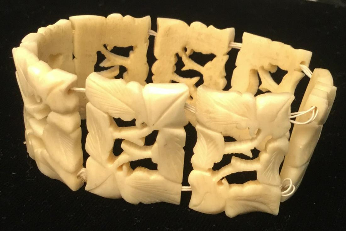 Bone Tile Bracelet: Stretch Bracelet. Leaf Pattern Sculpted to fit into rectangular tiles. Tiles are able to move about stretched string. 3.5 in. diameter. Tiles are 1 x 3/4 in. 8 Bone Tiles. asian arts and crafts, Bone 