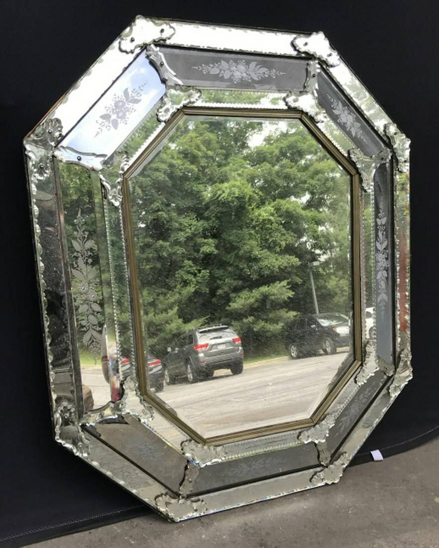 Italian Venetian Cushion Mirror W Etched Details: Possibly antique octagonal cushion mirror with floral etched details and applied glass & mirror brackets. Italian Venetian. Measures approx 44.25 inches in height by 37.25 inches in width. Some surfac