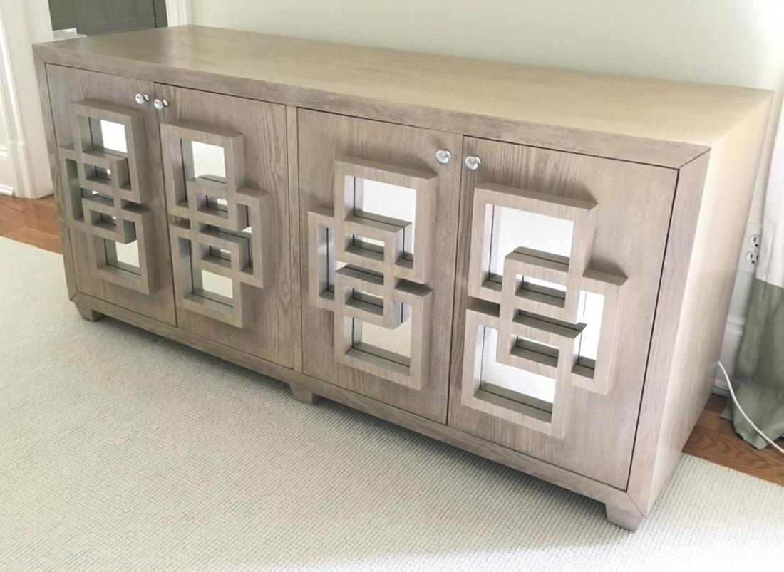Contemporary Sideboard W Geometric Raised Design: Contemporary Wooden Sideboard W Geometric Raised Design with mirrored accents, and silver toned metal drawer knobs. Four lower doors open to two storage areas w shelf, very good condition, minor surfa