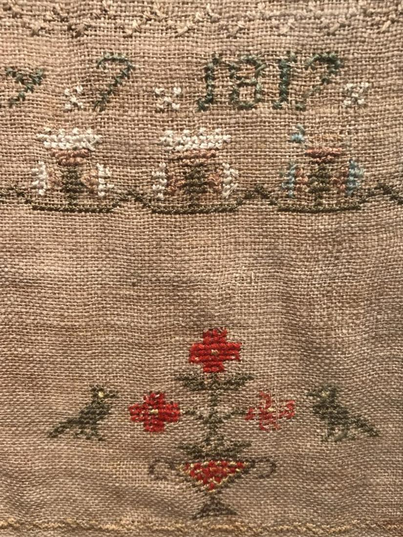 Antique Signed Alphabet Sampler, 1817: Embroidered Alphabet Sampler, Signed Sarah Mazen, dated May 7, 1817. Sampler features floral motifs. Sampler is matted and set behind glass in wood frame. Sampler measures approx 12 inches in height b