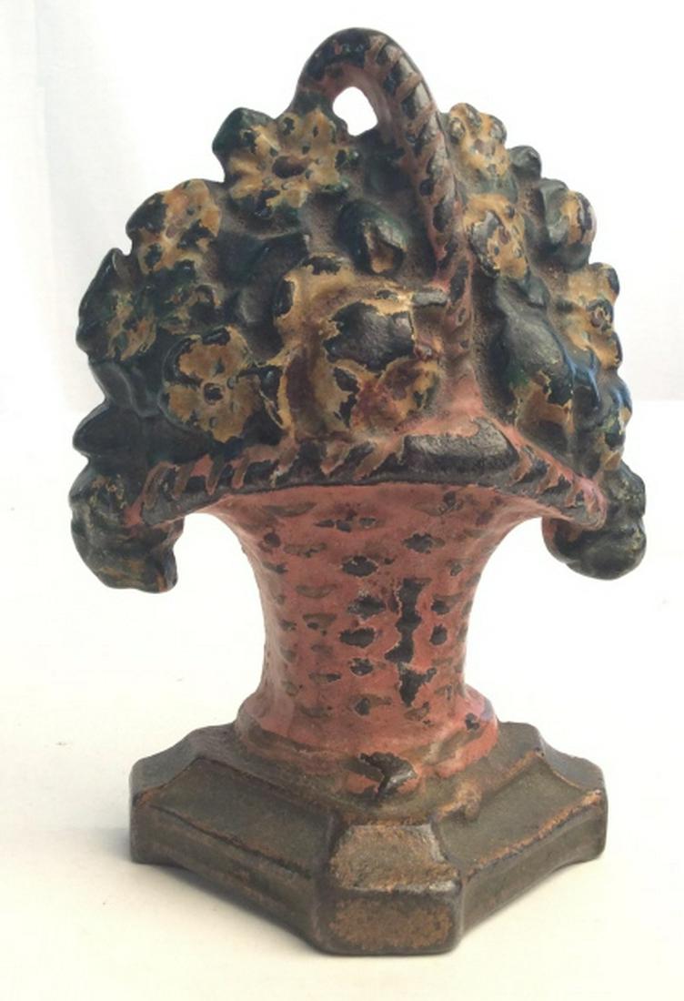 Cast Iron Yellow Flower Basket Door Stopper: Vintage Yellow hand painted flower basket cast iron door stopper. Door stopper measures at approximately 5.7 inches tall and approx 3.5 inches wide. Cast iron door stopper, cast iron, cast iron flower
