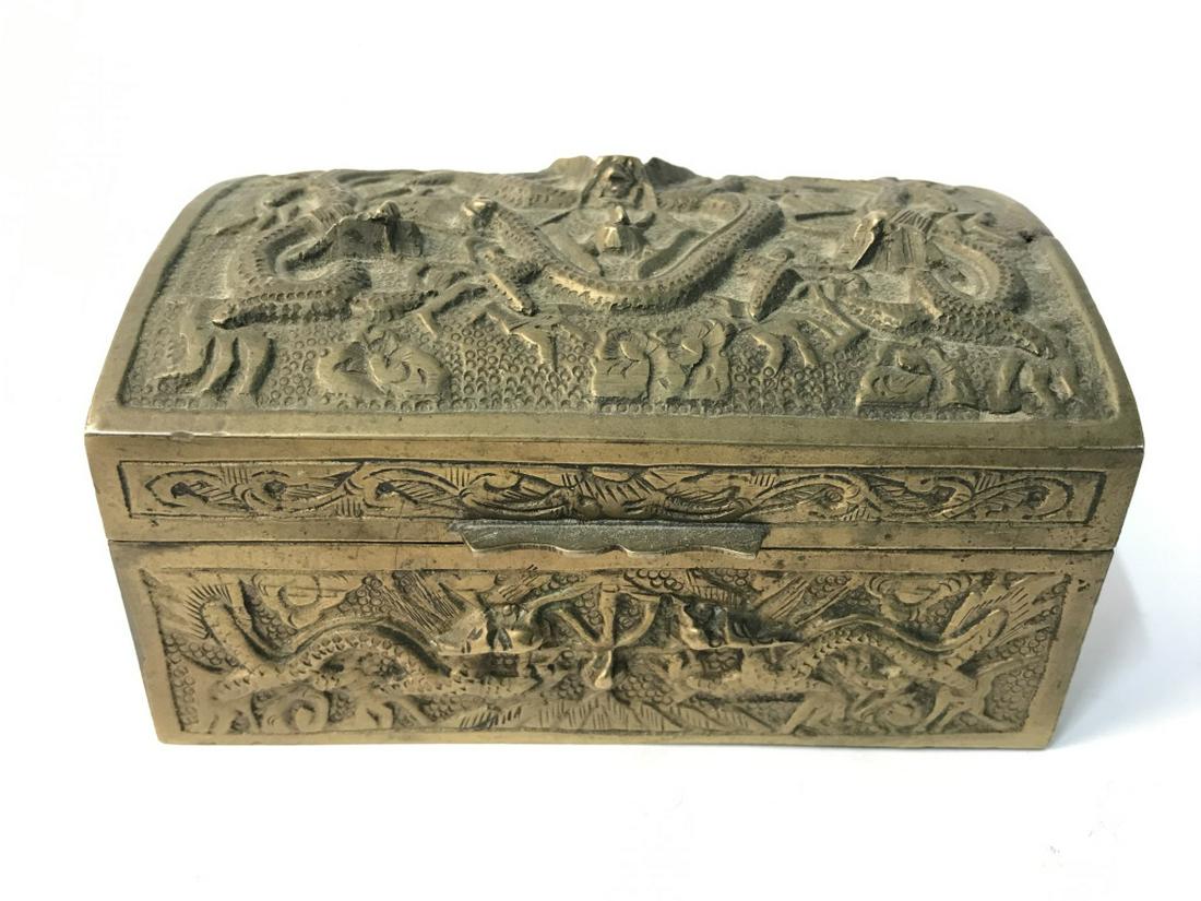 Gold Toned Brass Keepsake Box W Lid: Piece is gold toned. Appears to be brass. Contains beveled dragon detail. Box has lid. Measures approx 4.5 inches long 3.5 inches deep 2.5 inches tall. trinket dish, decorative arts and decor, keepsak