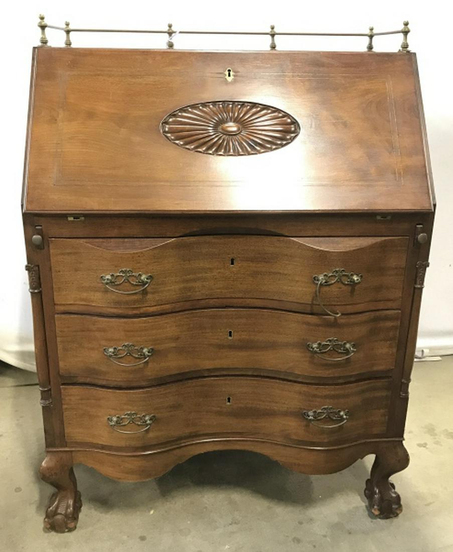 Mahogany Toned Governor Winthrop Slope Front Desk: Vintage pos antique Mahogany Toned Governor Winthrop Slope Front Desk with ball claw footed base, brass toned metal hardware and carved design. Measures approx 42 inches tall x 30 inches wide x 20 inc