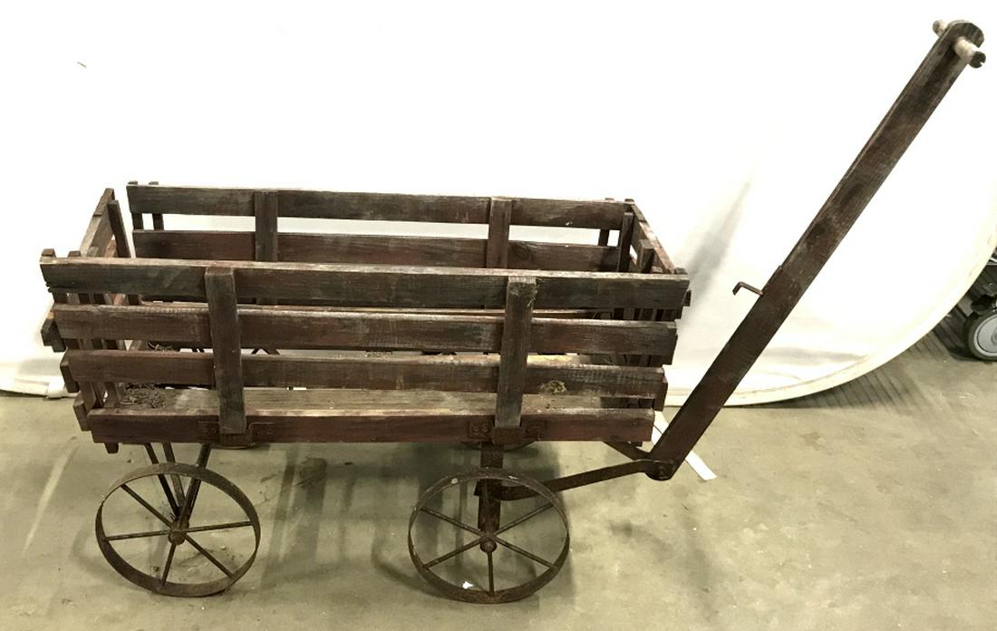 ANTIQUE FARM DRAWN CART HAY WAGON: Tall handle connected to front wheels that pivot 90 degrees left and right. Handle measures 34 in. Tall. Removable sides to use as a flatbed. Wheels are metal. Wagon Box measures, 32.5 x 17.5 in. 21.