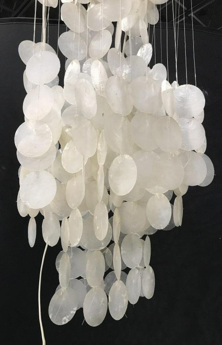 Oversized MCM Verner PANTON Capiz Shell Chandelier: Mid-Century Modern 3-tier Capiz Shell chandelier in the style of Verner Panton's 1964 '3DM' design. 1 socket for each tier, with 3 bulbs total. Capiz Shells hang from wood. Measures approx 70 inches i